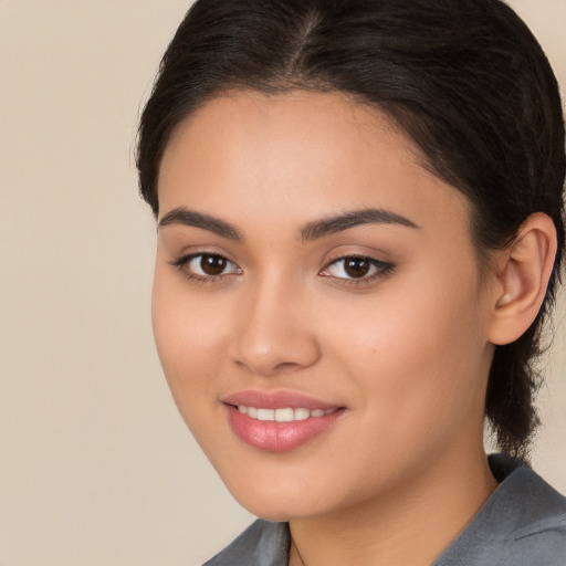 Joyful white young-adult female with long  brown hair and brown eyes