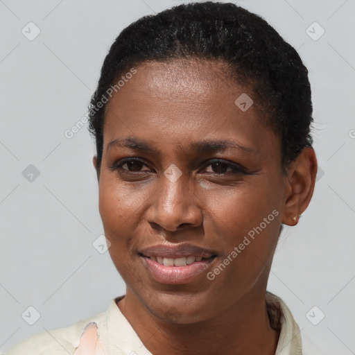 Joyful black young-adult female with short  brown hair and brown eyes