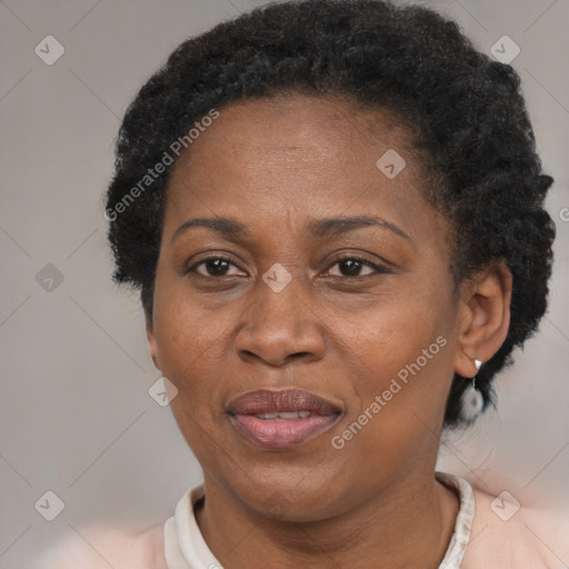 Joyful black adult female with short  brown hair and brown eyes