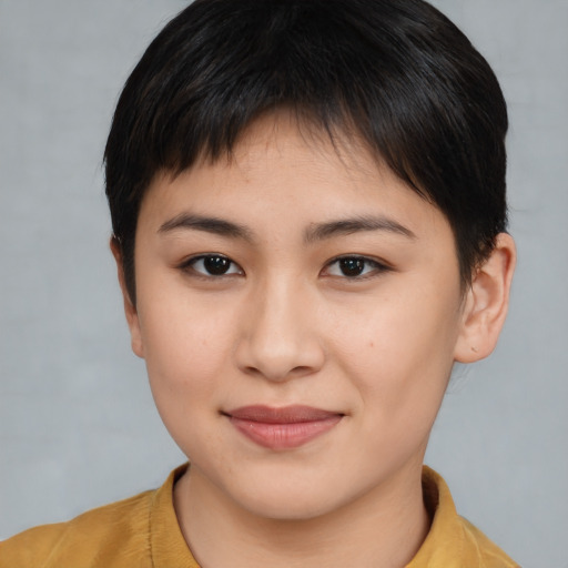 Joyful asian young-adult female with short  brown hair and brown eyes