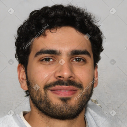 Joyful latino young-adult male with short  brown hair and brown eyes