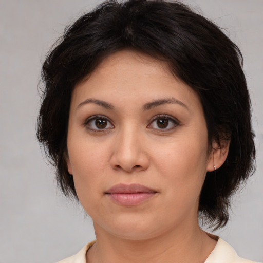 Joyful white young-adult female with medium  brown hair and brown eyes