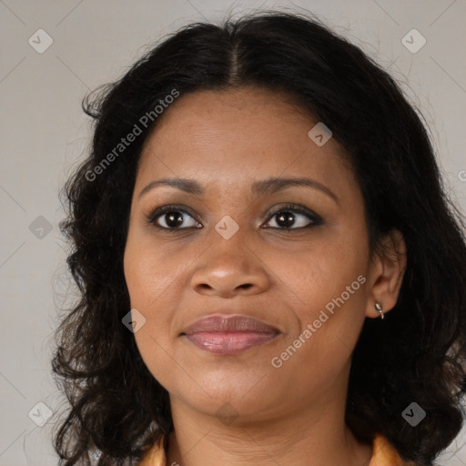 Joyful black adult female with medium  brown hair and brown eyes