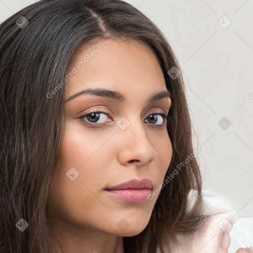 Neutral white young-adult female with long  brown hair and brown eyes