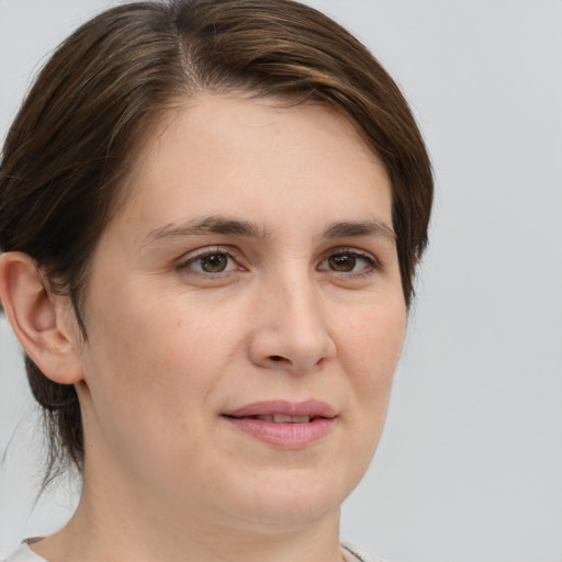 Joyful white young-adult female with medium  brown hair and brown eyes