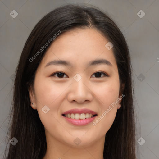 Joyful asian young-adult female with long  brown hair and brown eyes