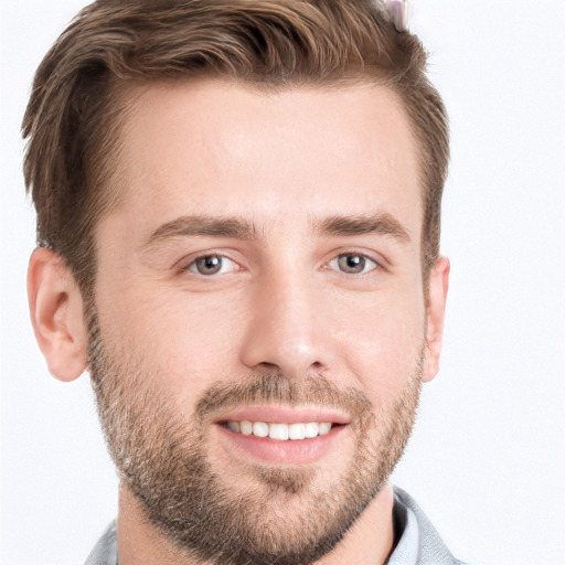 Joyful white young-adult male with short  brown hair and grey eyes