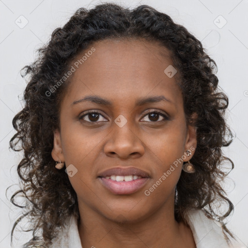 Joyful black young-adult female with long  brown hair and brown eyes