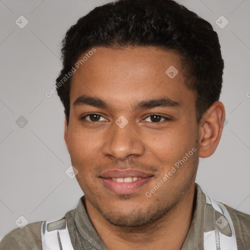 Joyful black young-adult male with short  brown hair and brown eyes