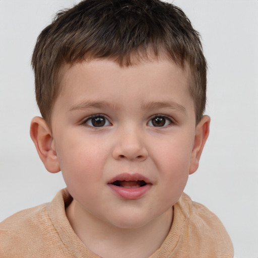 Joyful white child male with short  brown hair and brown eyes