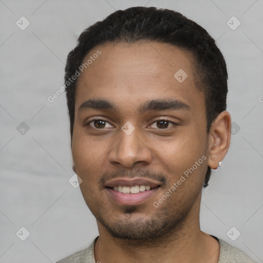 Joyful black young-adult male with short  black hair and brown eyes