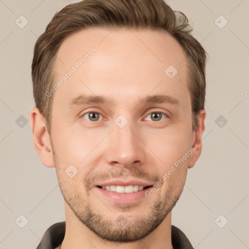 Joyful white young-adult male with short  brown hair and grey eyes