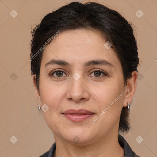 Joyful white adult female with medium  brown hair and brown eyes