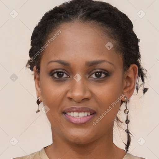 Joyful black young-adult female with long  brown hair and brown eyes