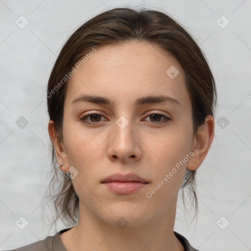 Neutral white young-adult female with medium  brown hair and brown eyes