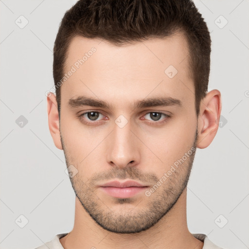 Neutral white young-adult male with short  brown hair and brown eyes