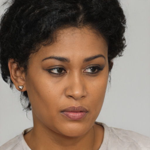 Neutral black young-adult female with short  brown hair and brown eyes