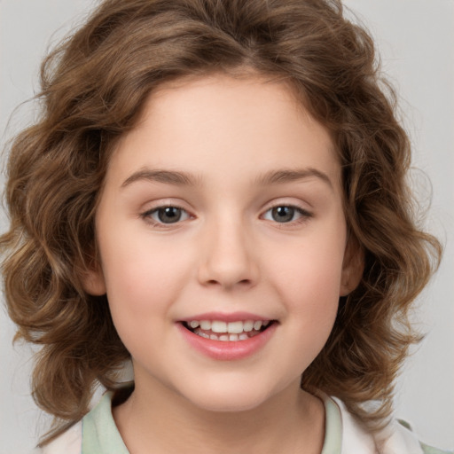 Joyful white child female with medium  brown hair and brown eyes