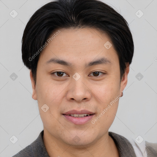 Joyful asian young-adult male with short  brown hair and brown eyes