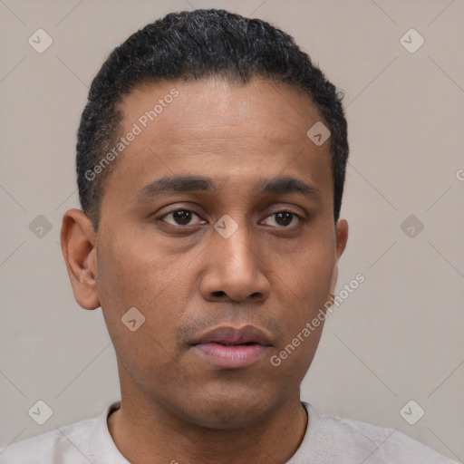 Neutral latino young-adult male with short  black hair and brown eyes