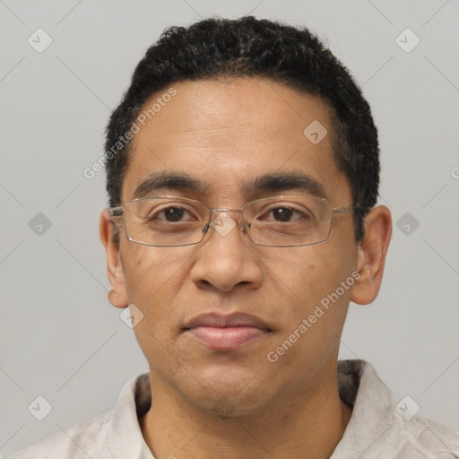 Joyful latino adult male with short  black hair and brown eyes