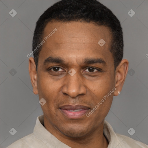 Joyful latino adult male with short  black hair and brown eyes