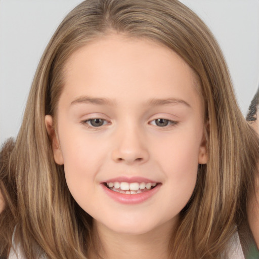 Joyful white child female with long  brown hair and brown eyes