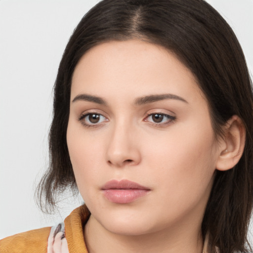 Neutral white young-adult female with long  brown hair and brown eyes