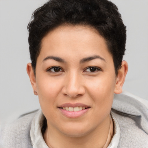 Joyful asian young-adult female with short  brown hair and brown eyes