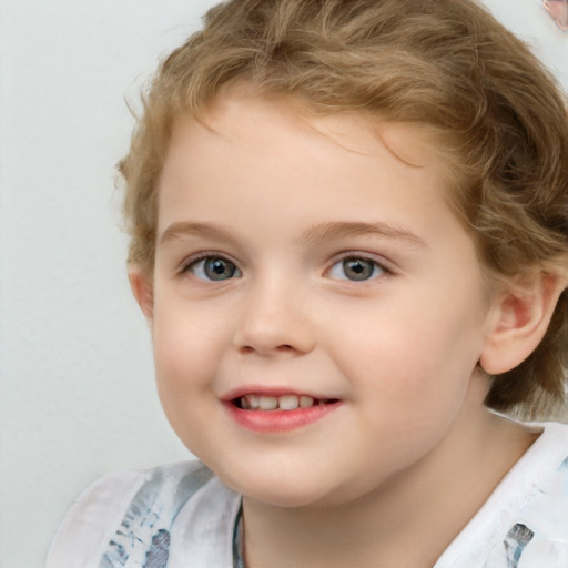 Joyful white child female with short  brown hair and blue eyes