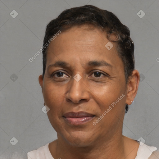 Joyful black adult male with short  brown hair and brown eyes