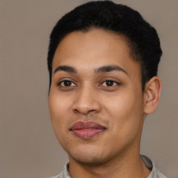 Joyful latino young-adult male with short  black hair and brown eyes