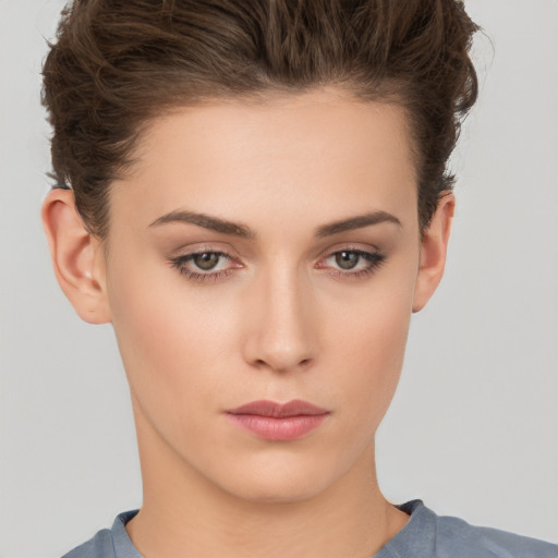 Neutral white young-adult female with short  brown hair and brown eyes