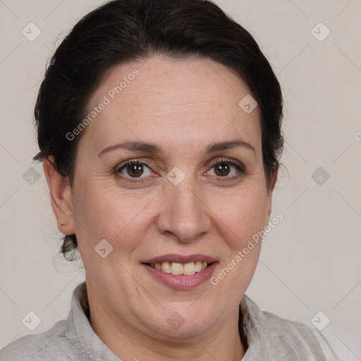 Joyful white adult female with medium  brown hair and brown eyes