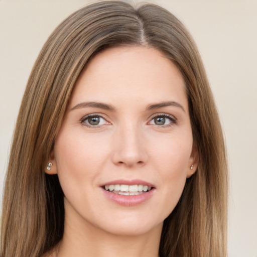 Joyful white young-adult female with long  brown hair and grey eyes