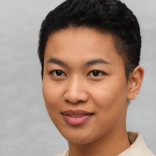 Joyful latino young-adult female with short  black hair and brown eyes