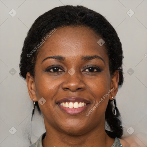 Joyful black young-adult female with medium  black hair and brown eyes