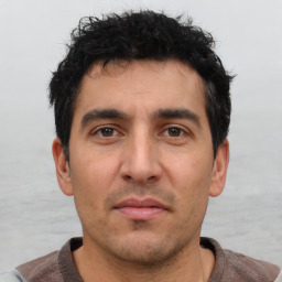 Neutral white young-adult male with short  black hair and brown eyes
