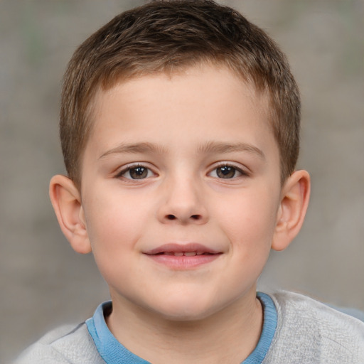 Joyful white child male with short  brown hair and brown eyes