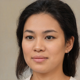 Joyful white young-adult female with medium  brown hair and brown eyes