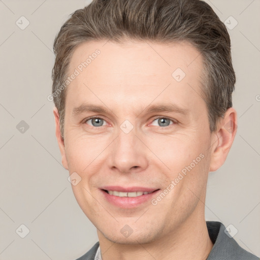 Joyful white adult male with short  brown hair and grey eyes