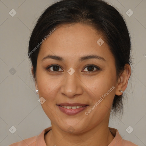 Joyful latino young-adult female with medium  brown hair and brown eyes