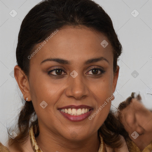 Joyful black young-adult female with medium  brown hair and brown eyes