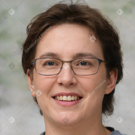 Joyful white adult female with medium  brown hair and green eyes