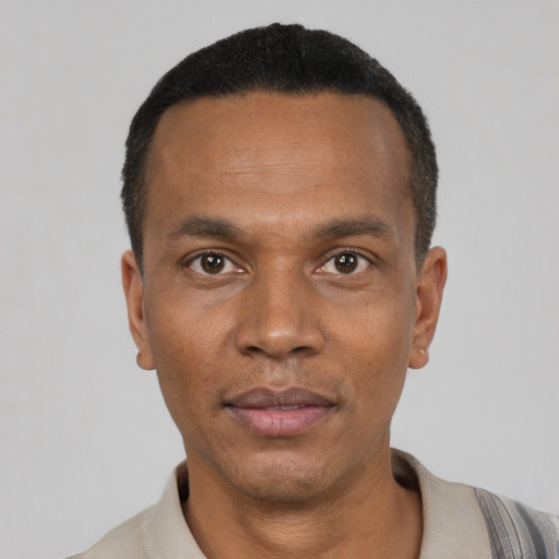 Neutral latino adult male with short  black hair and brown eyes