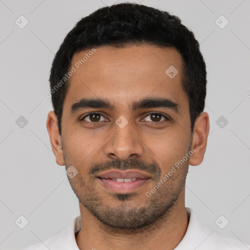 Joyful latino young-adult male with short  black hair and brown eyes