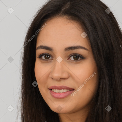 Joyful latino young-adult female with long  brown hair and brown eyes