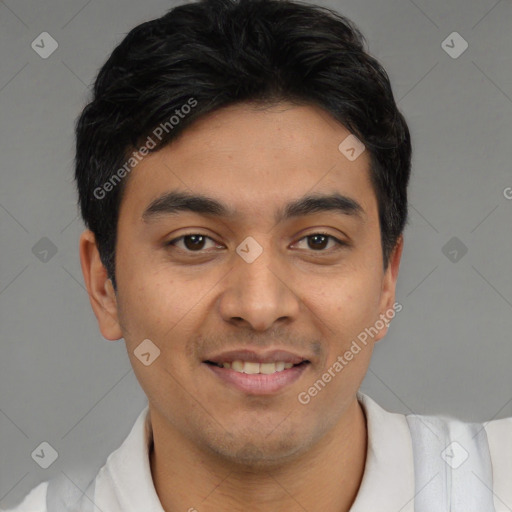 Joyful latino young-adult male with short  black hair and brown eyes