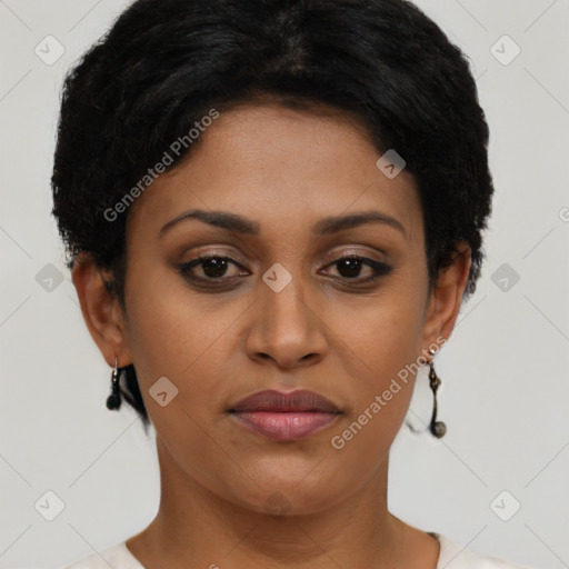 Joyful black young-adult female with short  black hair and brown eyes