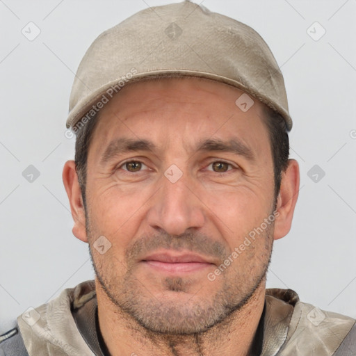 Joyful white adult male with short  brown hair and brown eyes